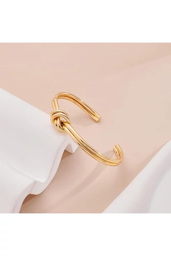 Brățară Elegantă Cu Nod Decorativ Din Titan Cu Finisaje Aurii
